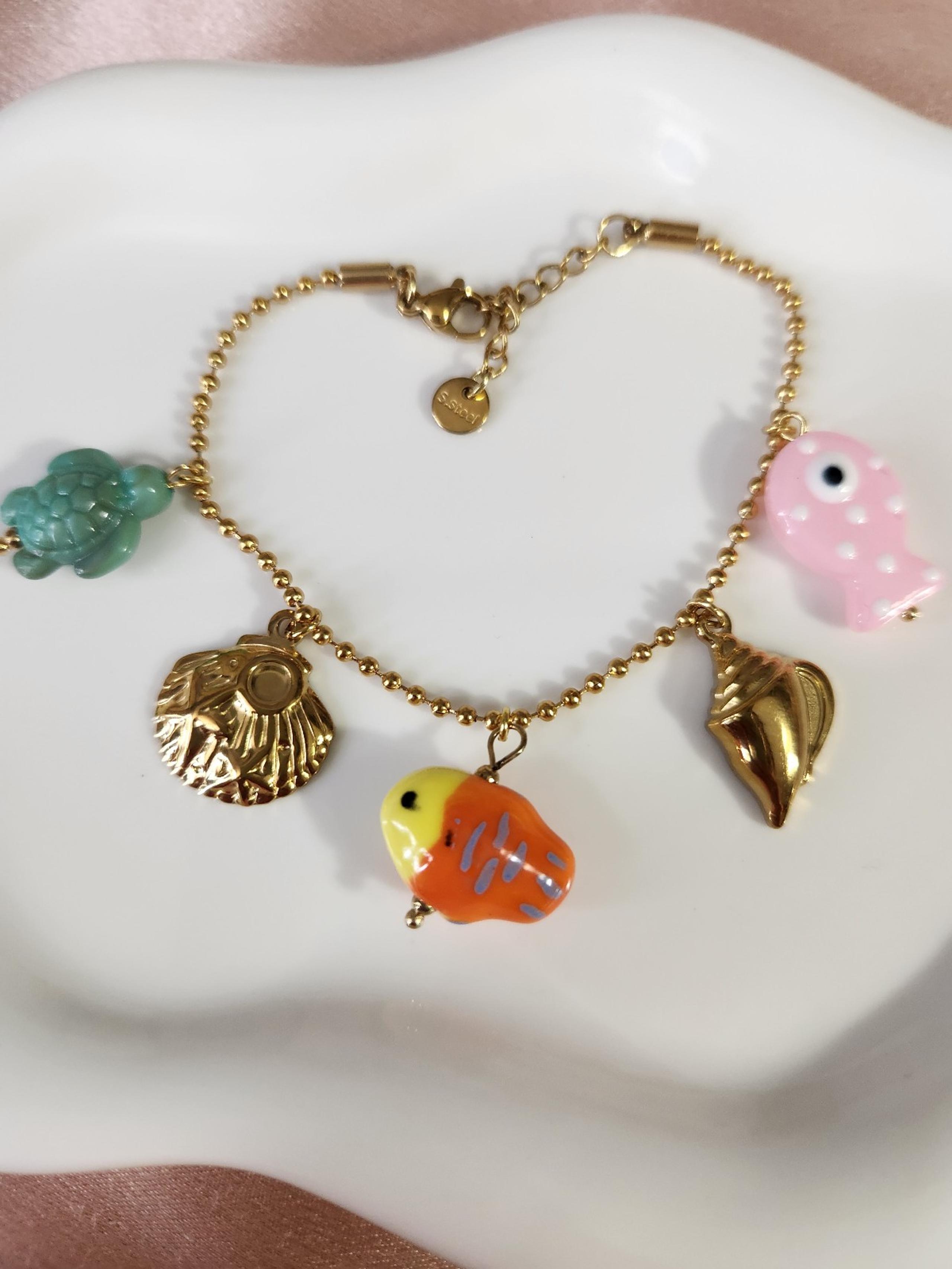 Gold sea creatures charm bracelet