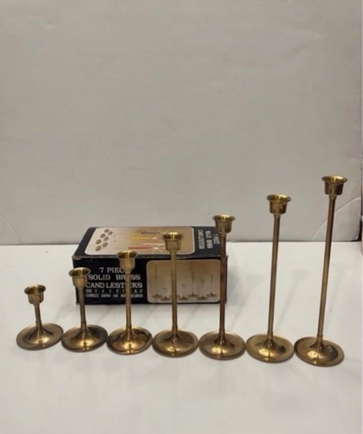 7 piece solid brass candle sticks (different sizes)