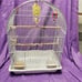 Bird cage with feeders, waterer, and toys. 16 W, 10 D, 24 H