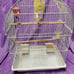 Bird cage with feeders, waterer, and toys. 16 W, 10 D, 24 H