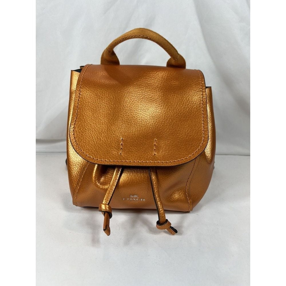 COACH MTLC DRBY BKPK TANGERINE