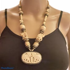 Carved bone elephant medallion necklace