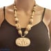 Carved bone elephant medallion necklace