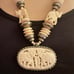 Carved bone elephant medallion necklace