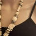 Carved bone elephant medallion necklace