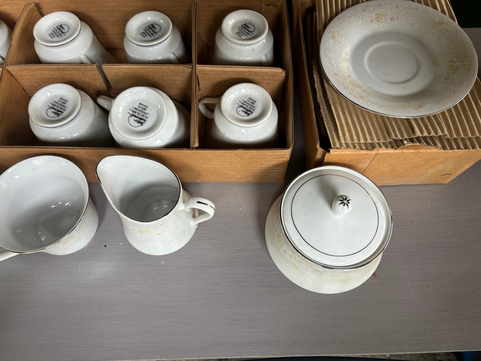 Antique teacup and saucer, sugar bowl, and creamer