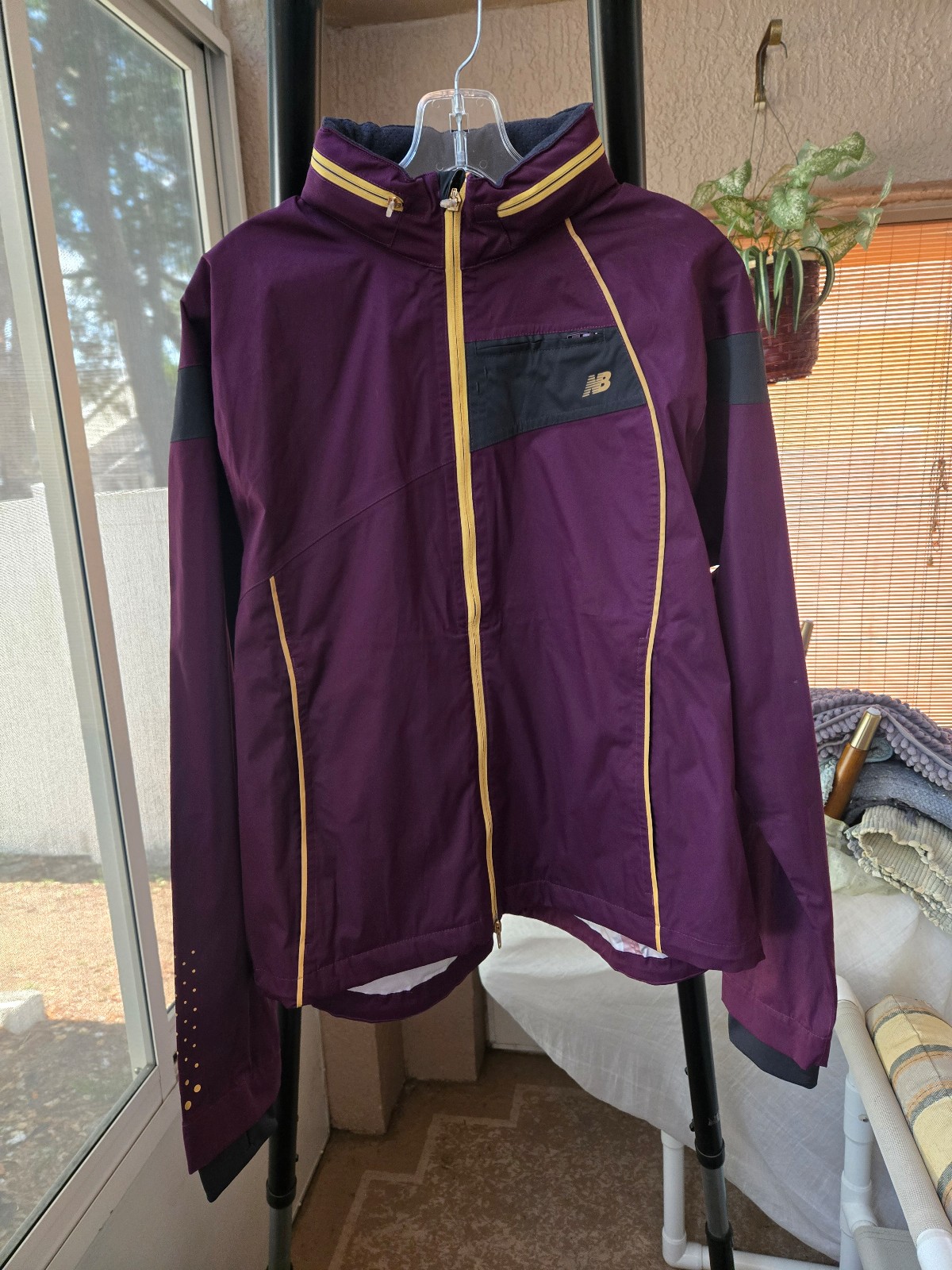 New Balance Purple jacket with yellow accents.