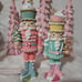 Two Pastel Nutcrackers / Toy Soldiers with cupcakes and gingerbread accents