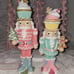 Two Pastel Nutcrackers / Toy Soldiers with cupcakes and gingerbread accents