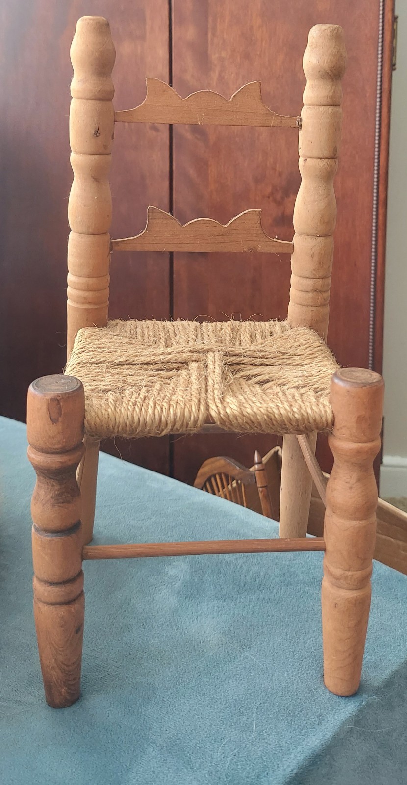 Antique doll's chair wooden carved and woven seat