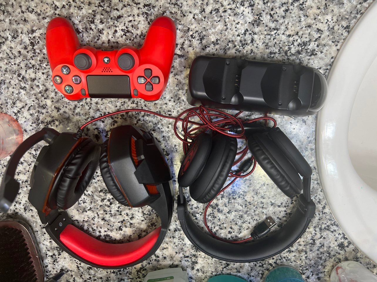 Brand new red controller woth chatger stand and two pair of headset headphones f