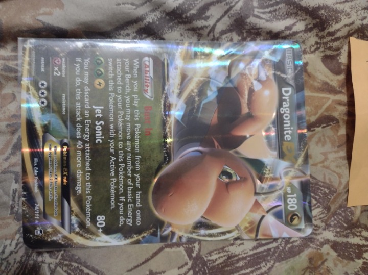 2014 Basic Big Dragonite Pokemon trading card in protective sleeve
