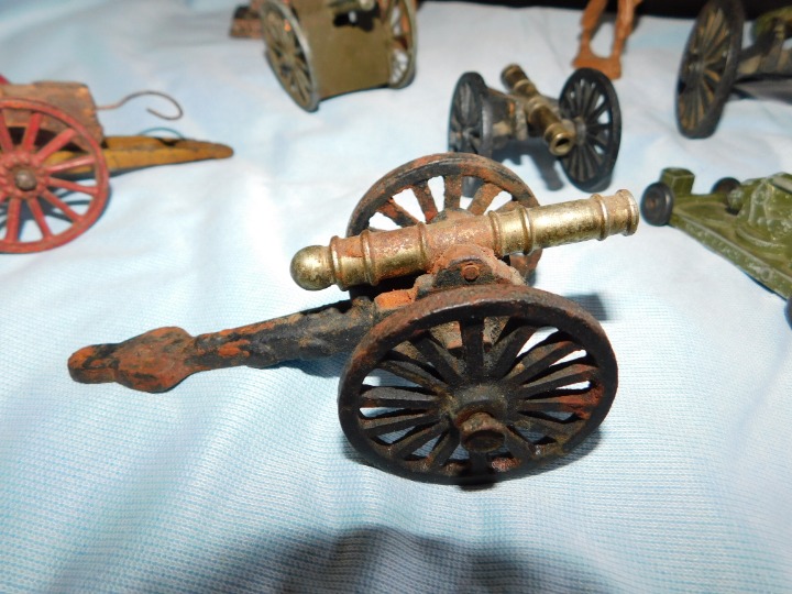 Vintage 6 cannons and 2 wooden soldiers