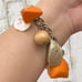 Vintage Orange Bakelite Mother of Pearl Shell Nautical Theme 7.5” Charm Bracelet