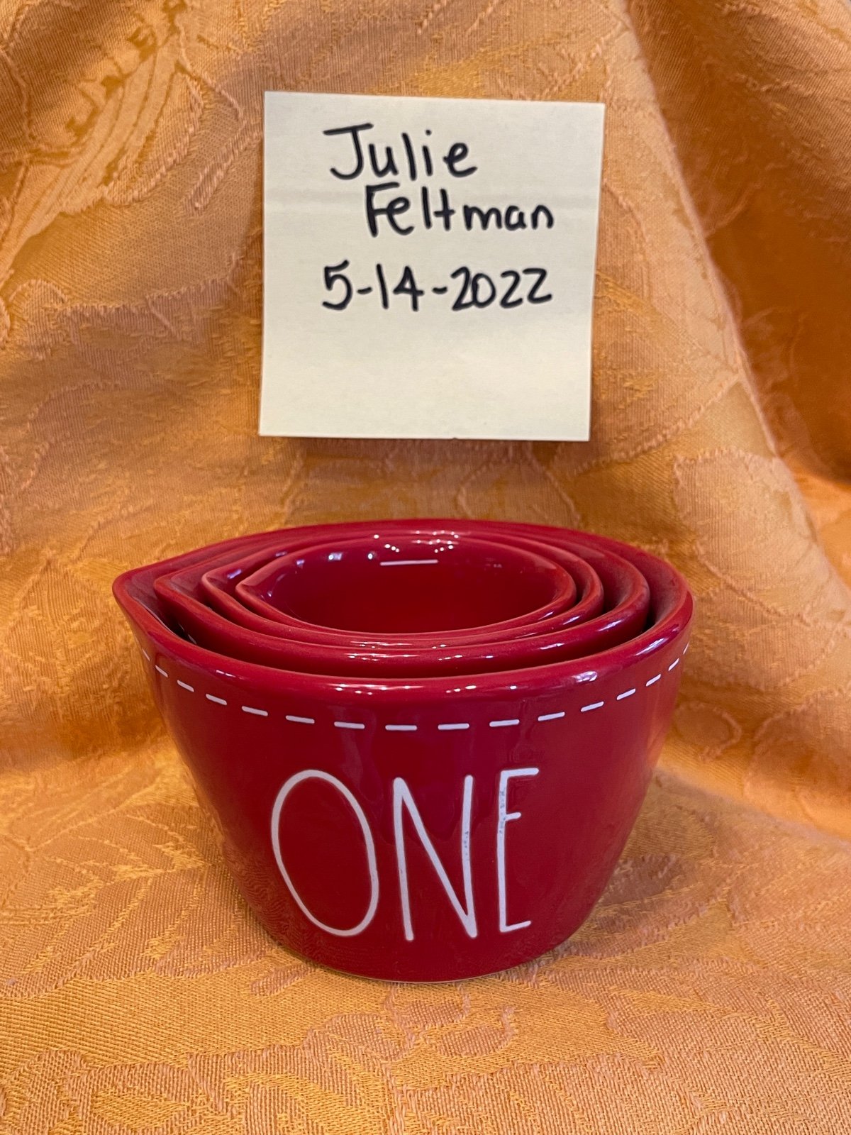 Rae Dunn red with white stitching measuring cups