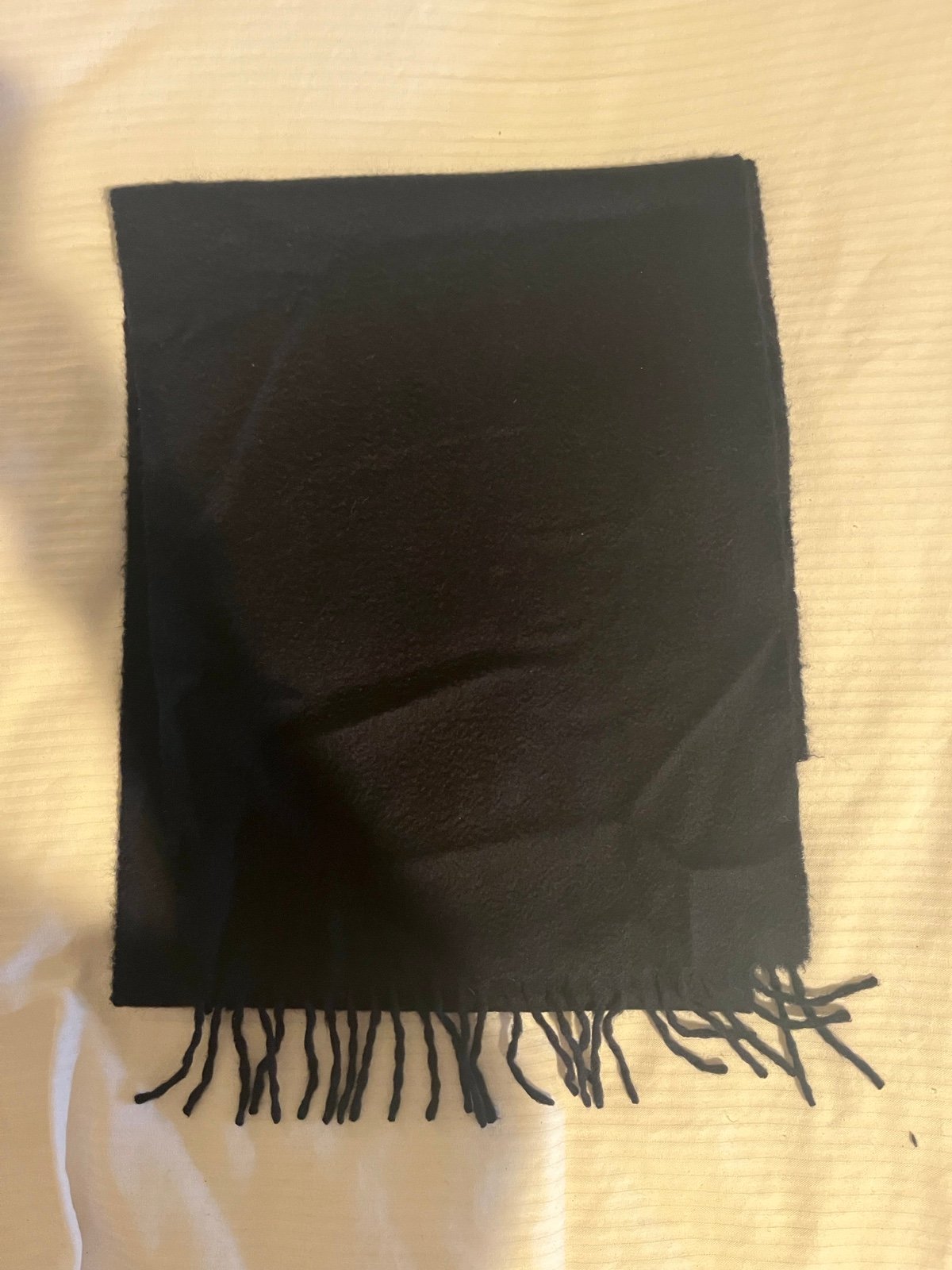 Cashmere fringed scarf by Brooks Brothers.