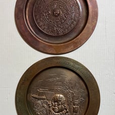 Pair of vintage Press Metal Aztec Wall Hanging Plates