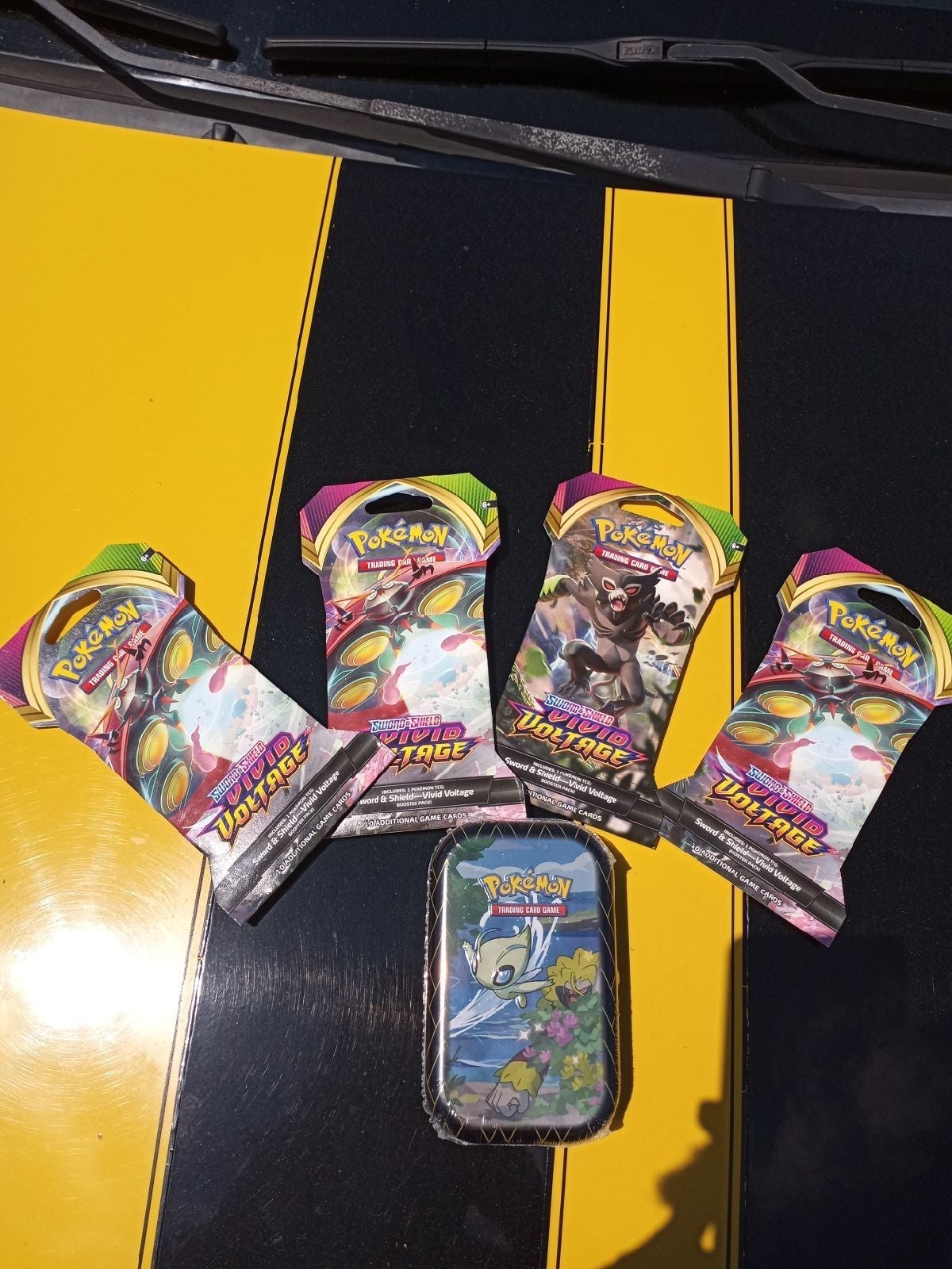 Pokemon packs and a Shining Fates tin