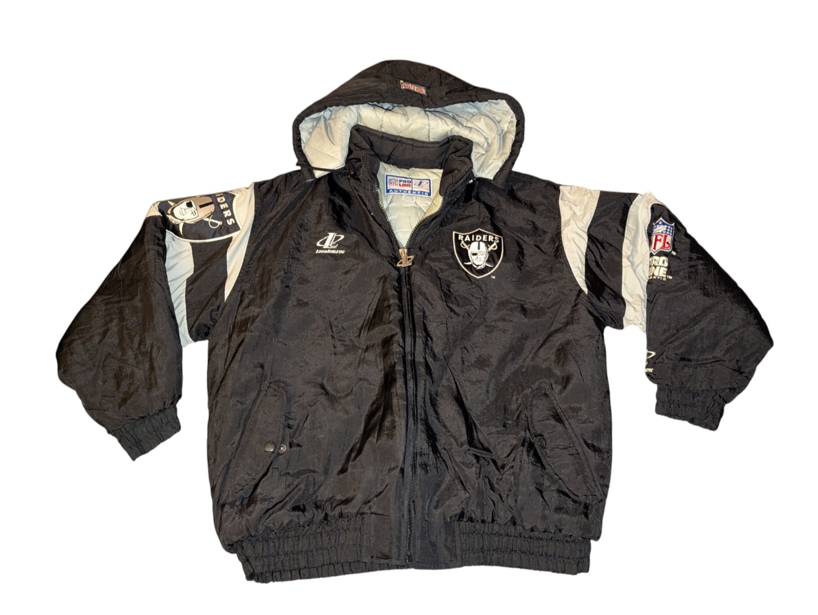 Vintage Oakland Raiders logo athletic puffer jacket