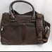 Brown tumi with croc embossed trim