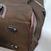 Brown tumi with croc embossed trim