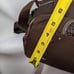 Brown tumi with croc embossed trim