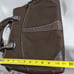 Brown tumi with croc embossed trim