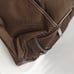 Brown tumi with croc embossed trim