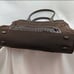 Brown tumi with croc embossed trim