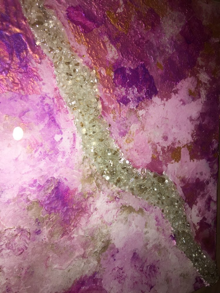 Homemade painting with crystals running along the center. The painting is covere