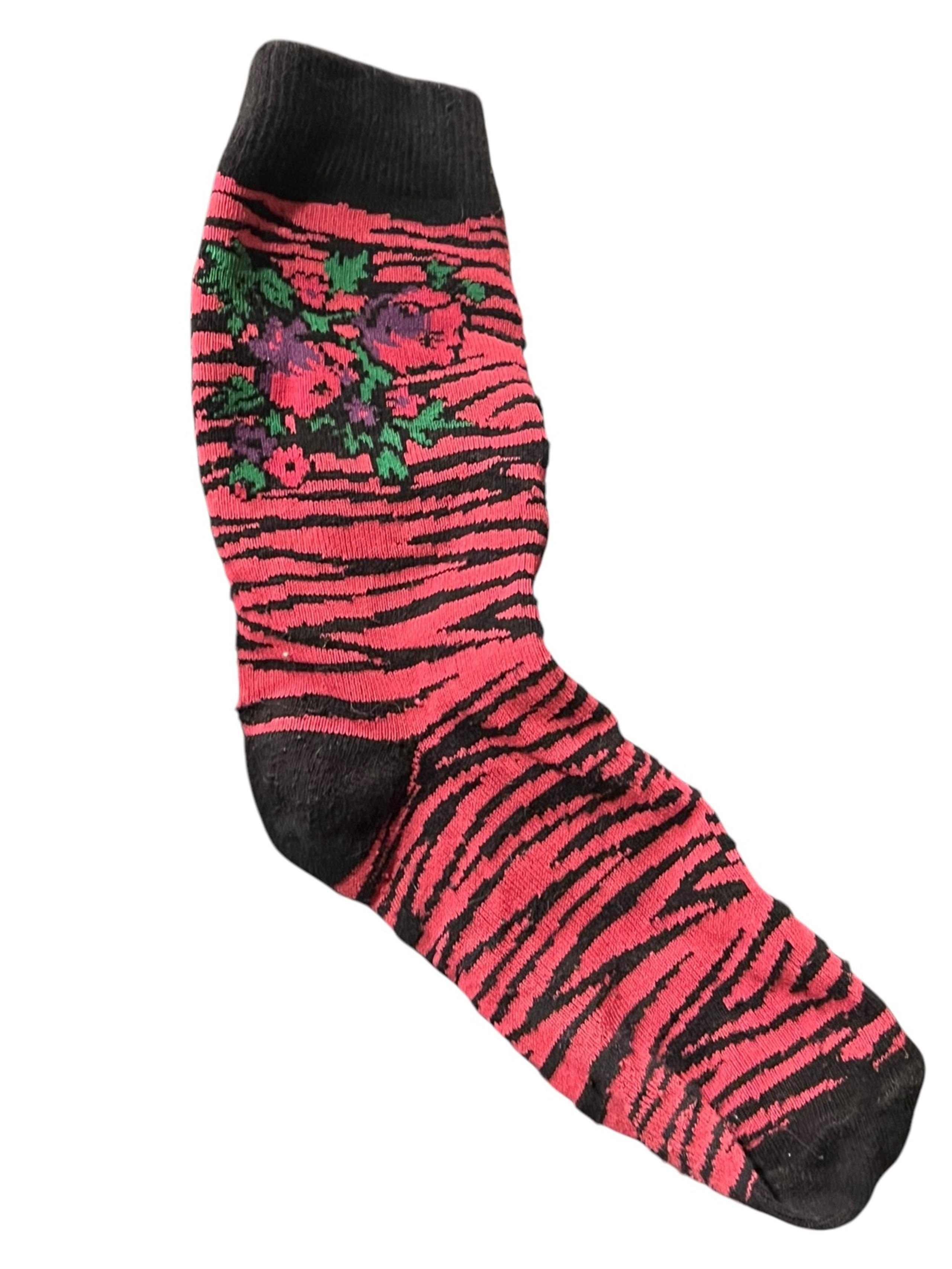 Stylish women’s socks featuring a vibrant pink  and black zebra pattern with flo