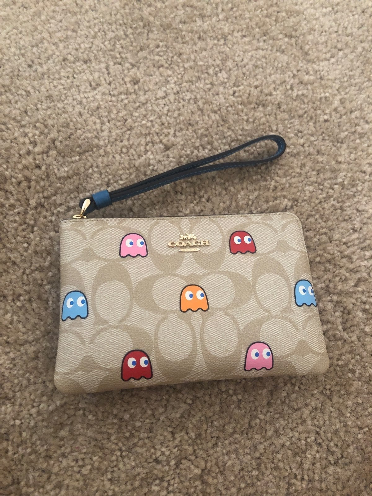 coach pac man wristlet