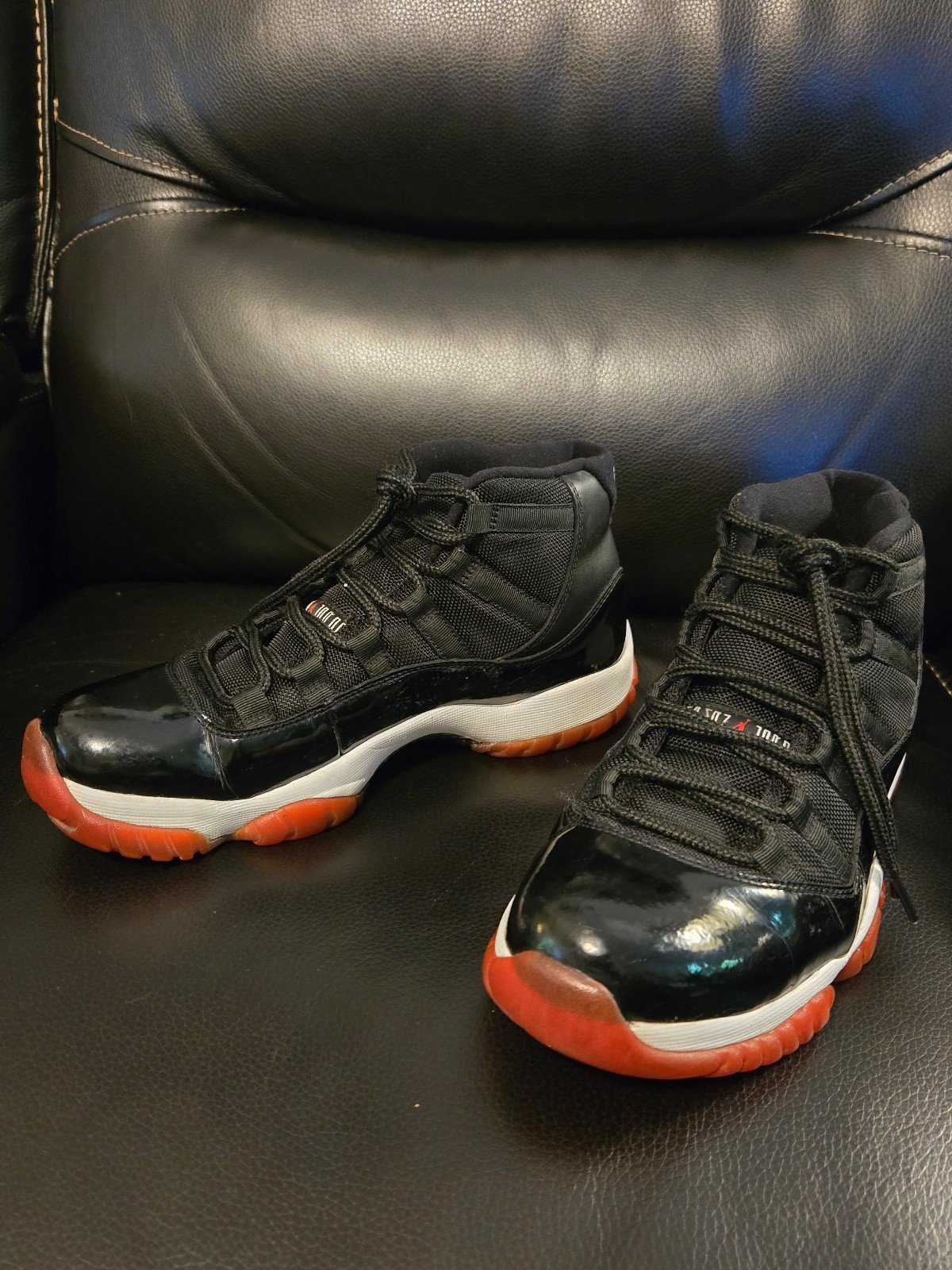 Air Jordan 11 Bred Sneakers.