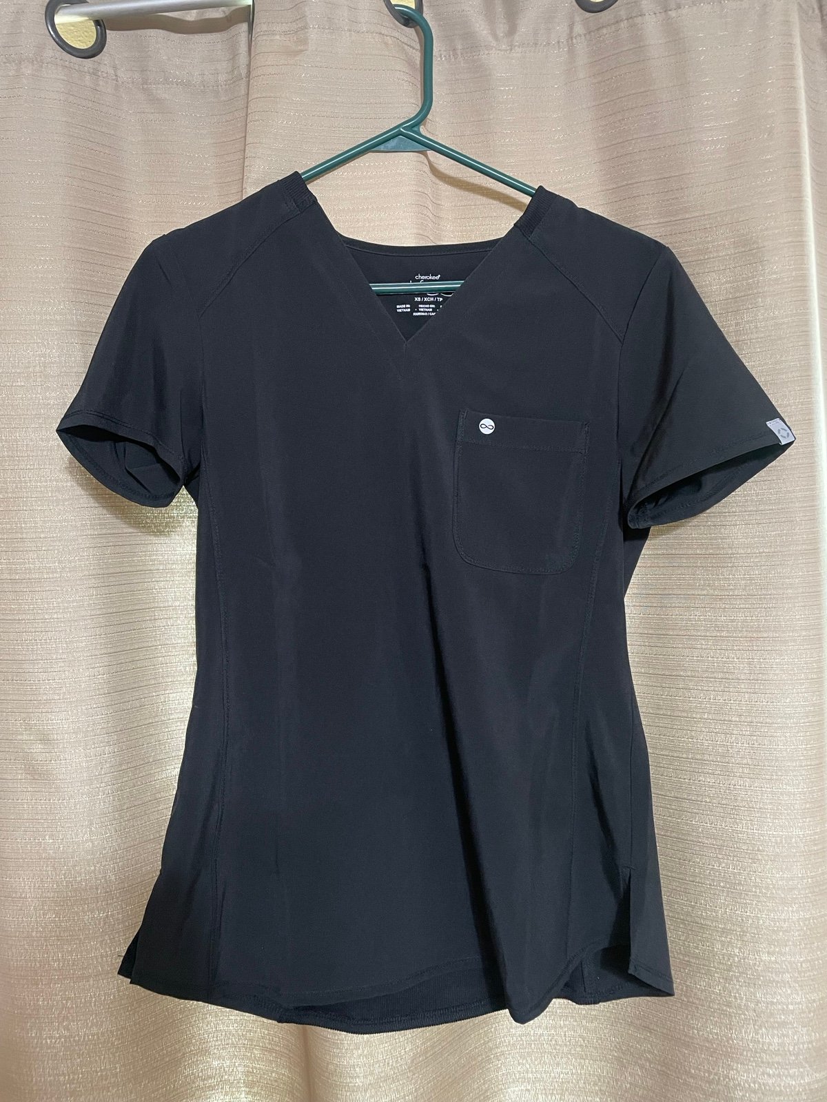 Black pair of scrubs
