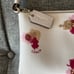 COACH Corner Zip Wristlet in Floral Print Coated Canvas