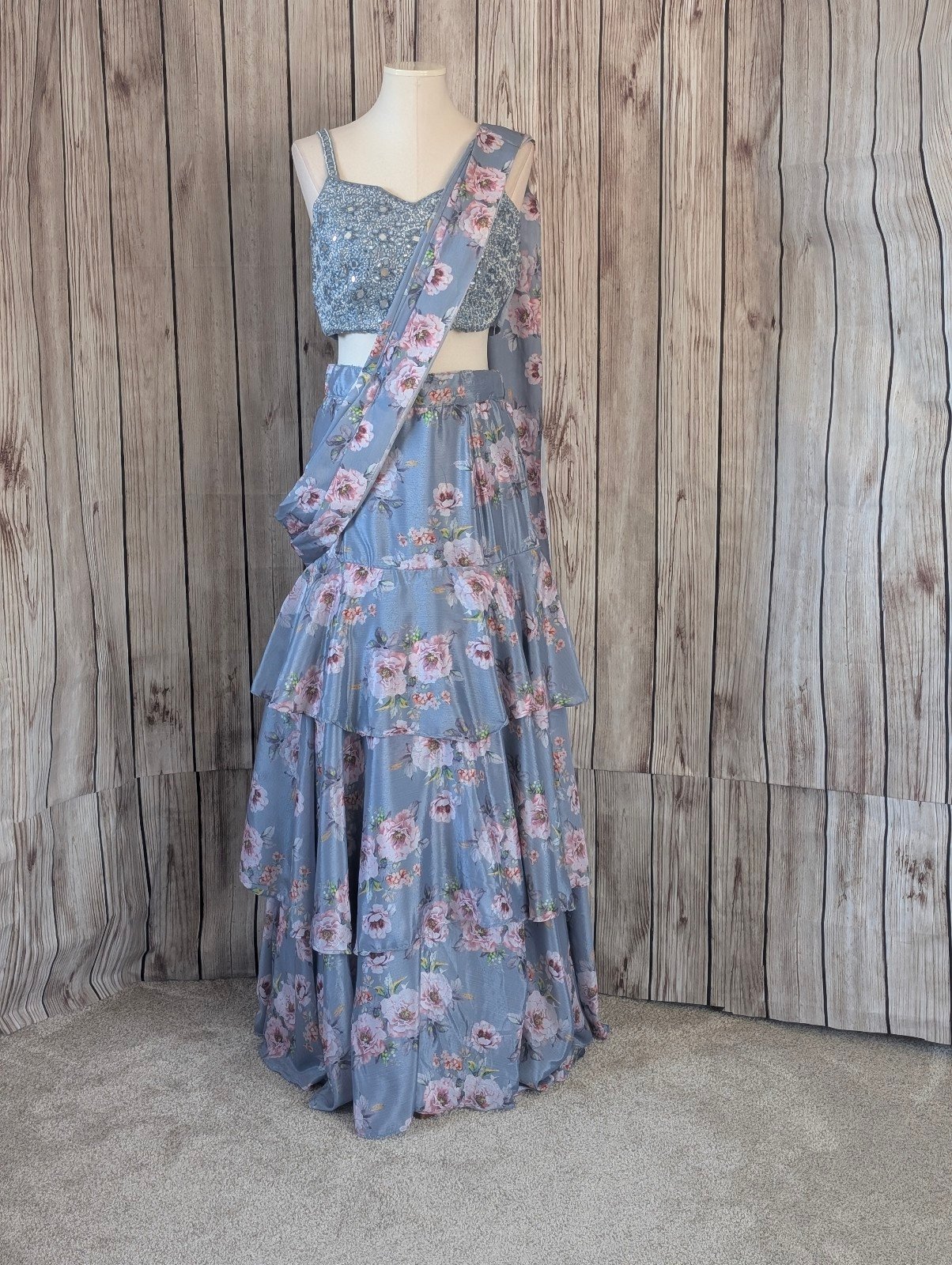 Ice Blue floral ruffled tiered skirt and crop top lehenga choli set.