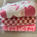 1-NWT COZY KNIT FEATHER WEIGHT CHECKERED RED, PINK THROW BLANKET