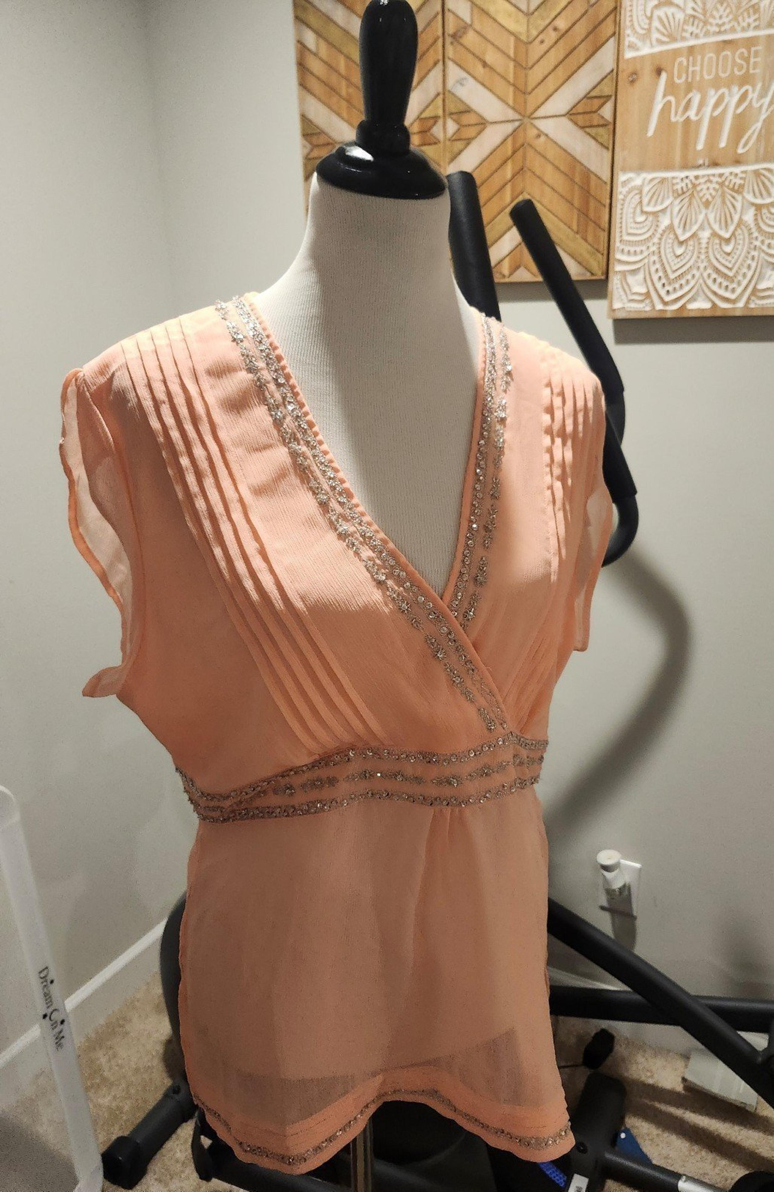 Light pink top with sequins detail