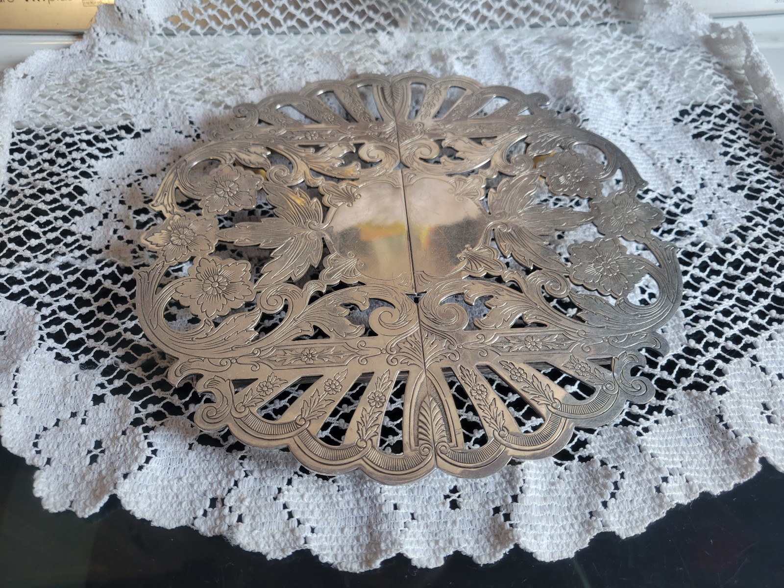 Antique silver expandable trivet
