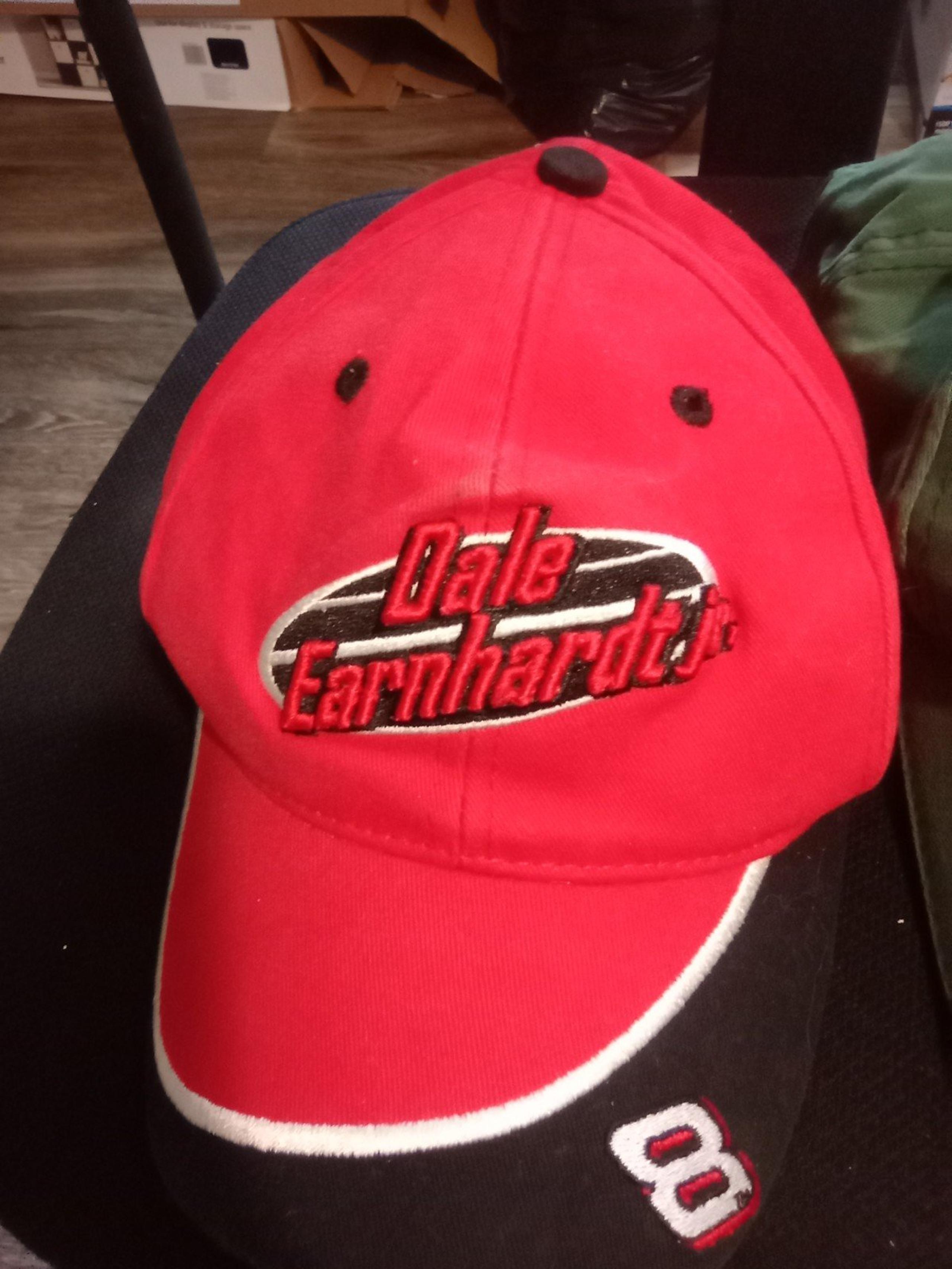 2 mens Nascar hats with the strap in the back