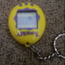 Tamagotchi 1997 vintage Yellow And Purple Works Keychain Bandai Game Pet