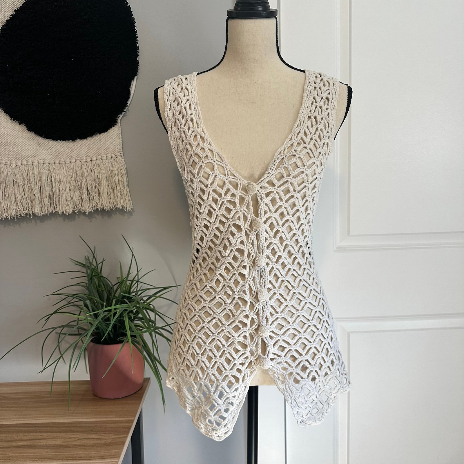 White crochet vest top with knit buttons and a boho vibe