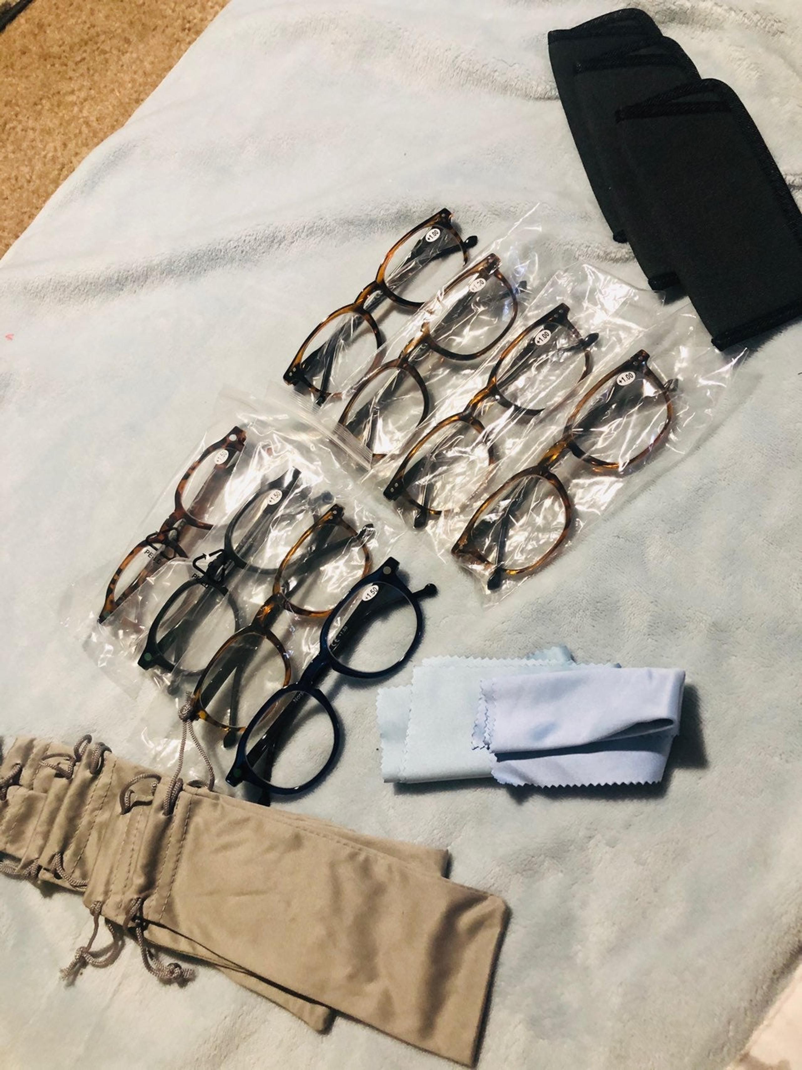 8 paors of reading glasses
