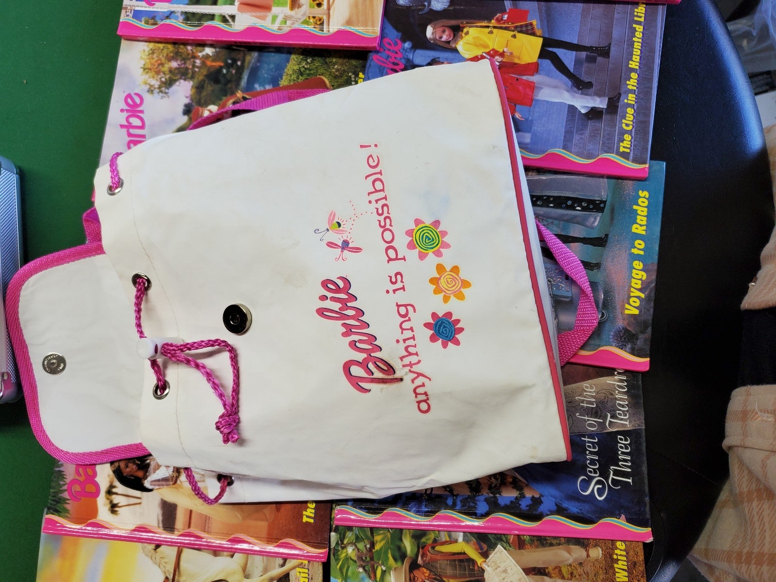 Barbie books and backpack
