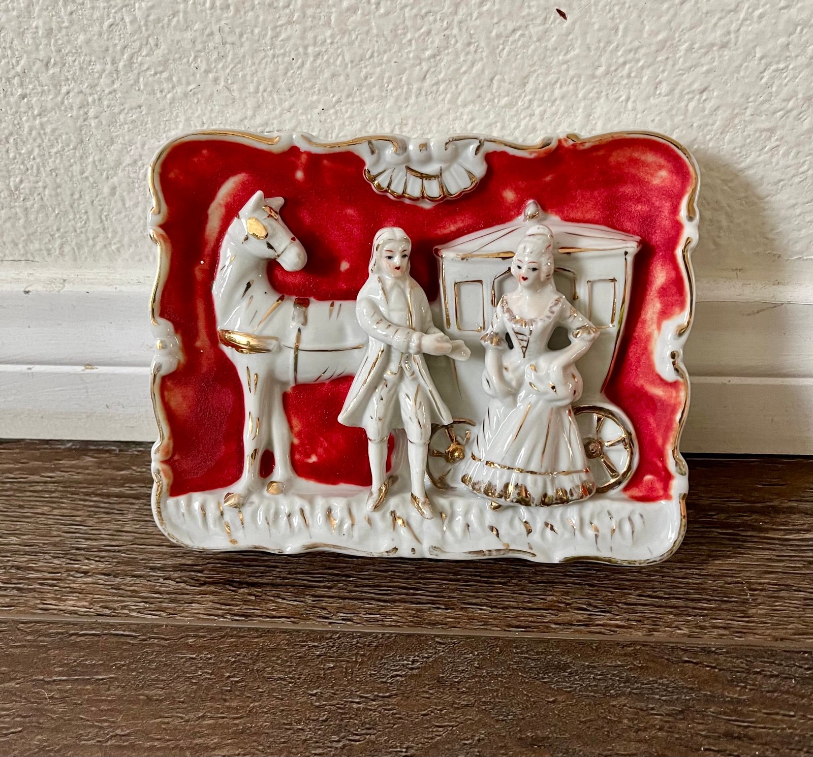 Vintage Porcelain Wall Plaque with Red Background