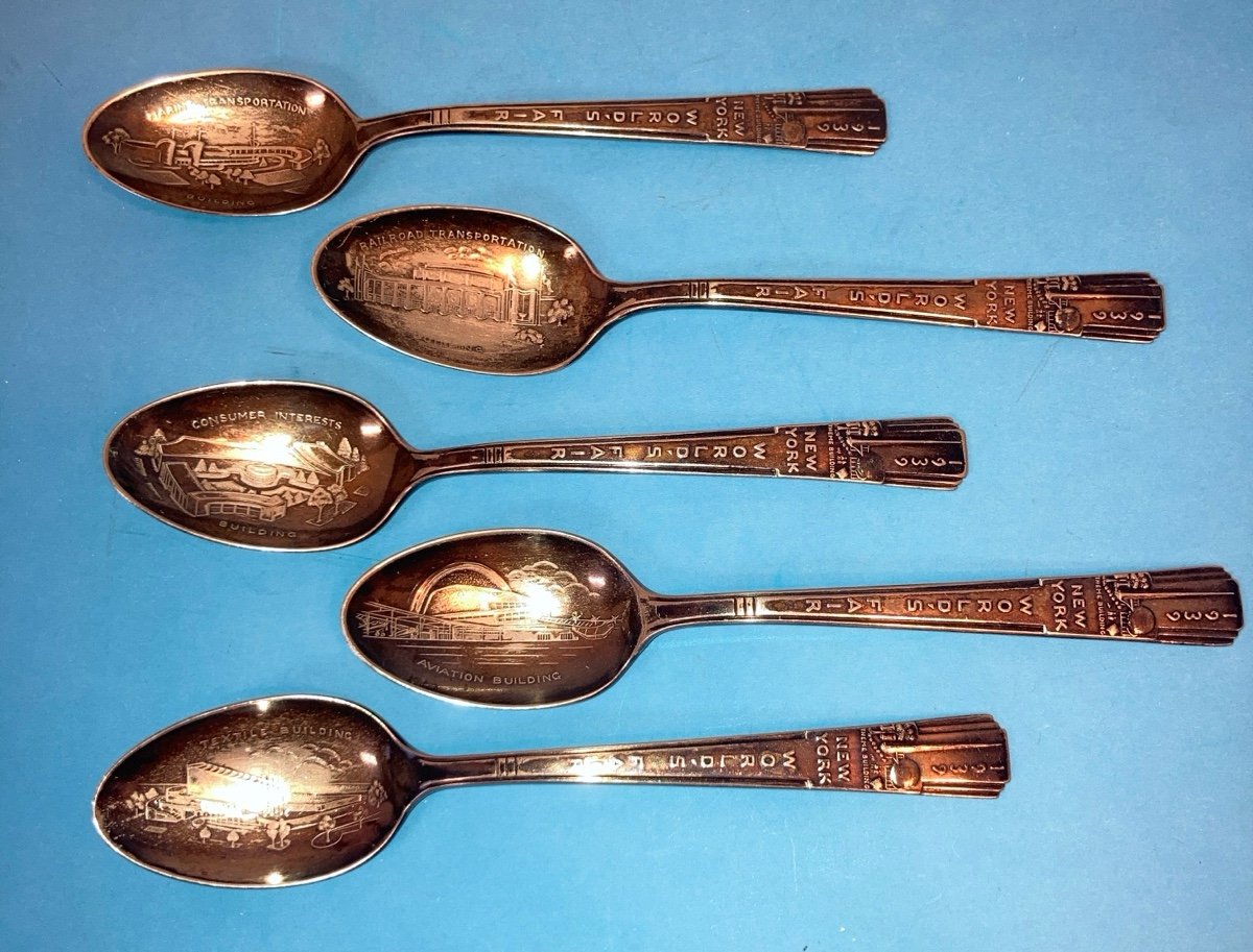 Collection of 1939 worlds fair silver plate spoons depicting exhibit buildings