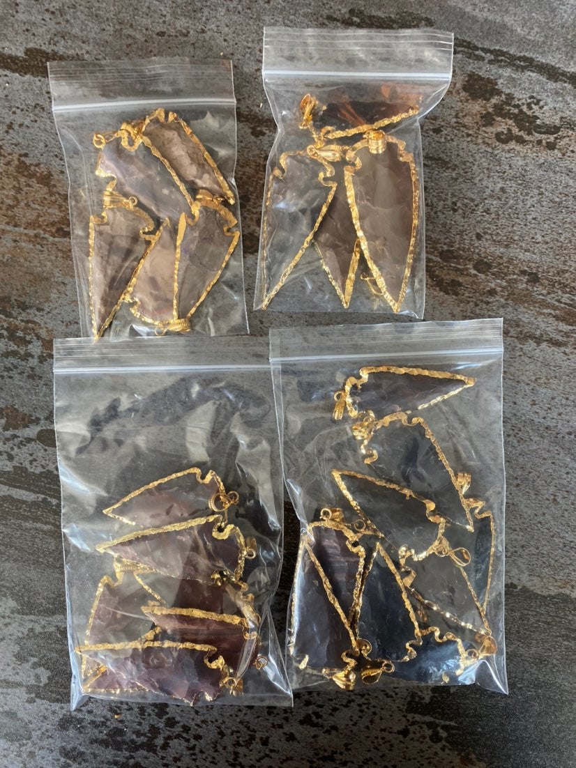 Lot of 27 gold plated arrowhead pendants