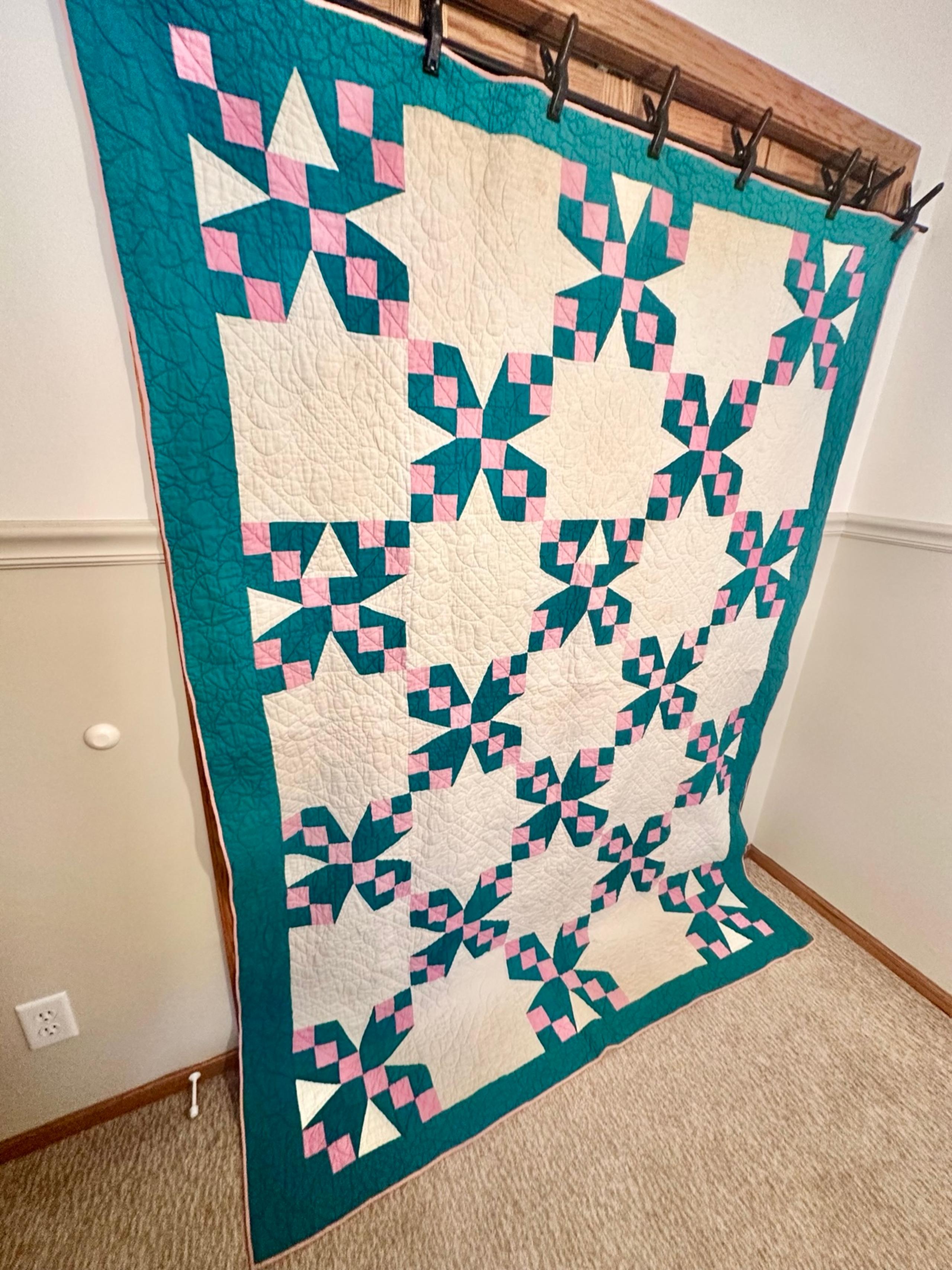 Handmade dark turquoise and pink quilt