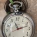 Vintage United clock company, wall, clock, pocket watch. The cord needs replaced