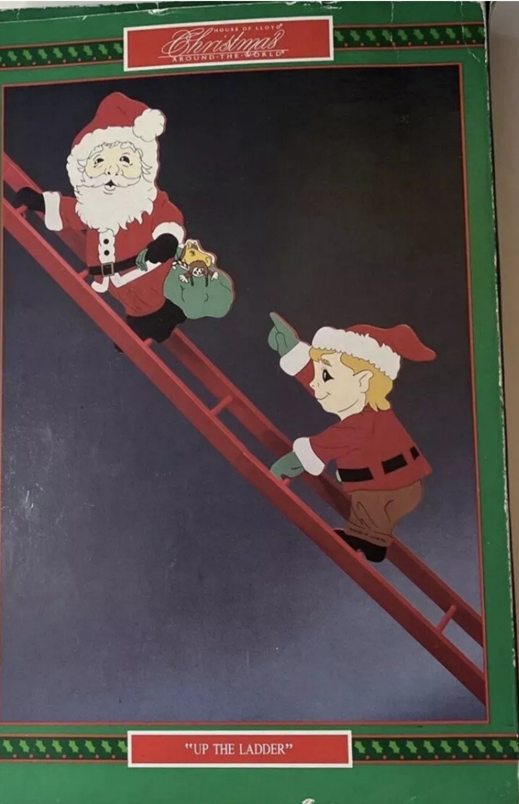 House of lyod Santa and elf up the ladder